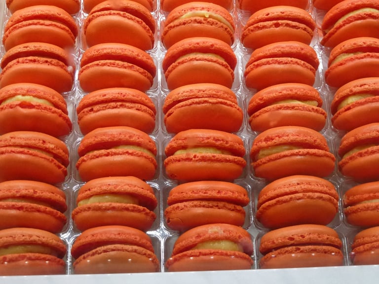 a box of orange macarons sitting on top of each other
France Trip; Travel Planner; 3Day Trip Plan; Photography; Gastronomy; Paris