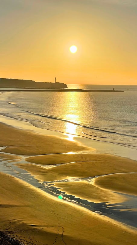 Portimão, the sun is setting over a sandy beach.
Portugal Trip; Travel Planner; 3Day Trip Plan; Photography